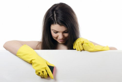 Professional cleaner disinfecting high-touch shared area surfaces